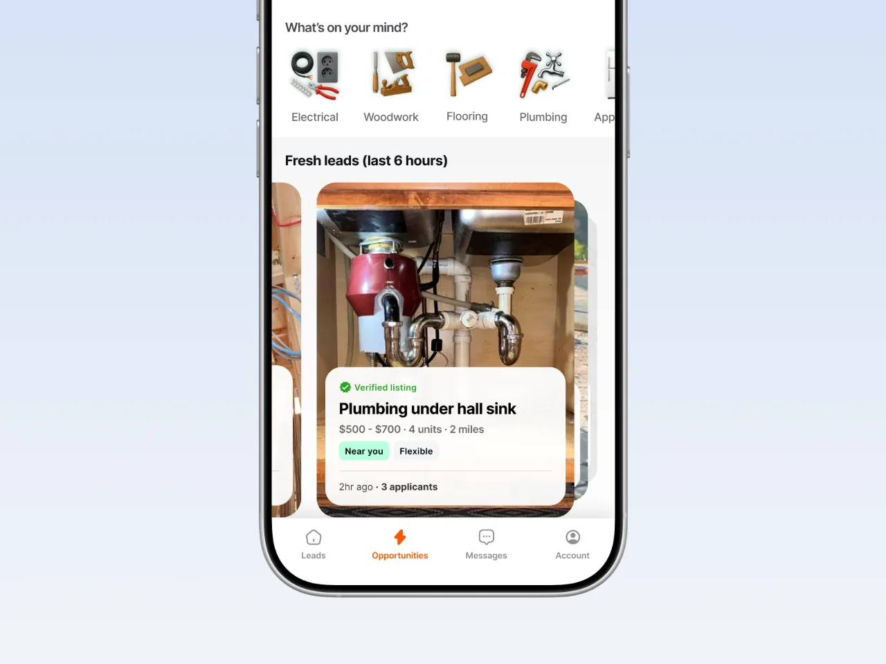 Mobile app screen for a home-services platform showing trade categories and a fresh plumbing job lead card with pricing and applicants.